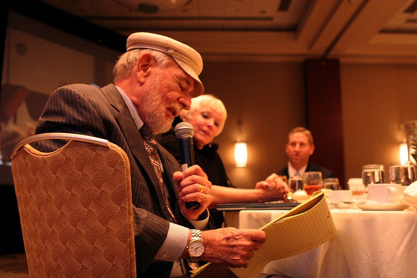 Gil Waters gives his speech of appreciation from his table.