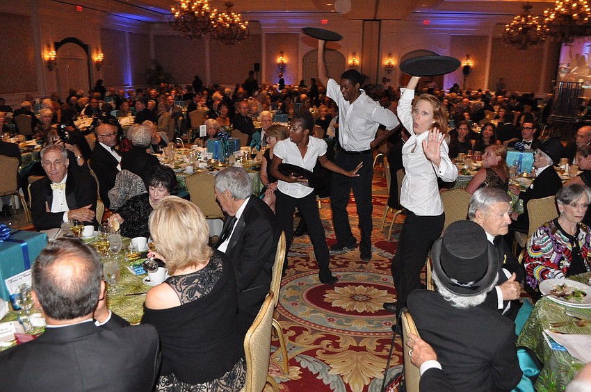 Fuzion dance performed as waiters throughout the crowd.