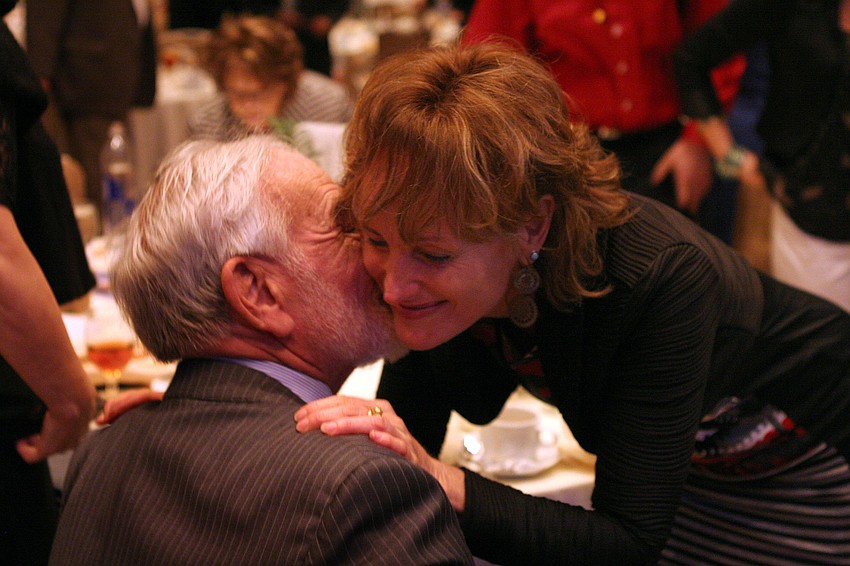 Gil Waters gives his daughter, Robin, a kiss.