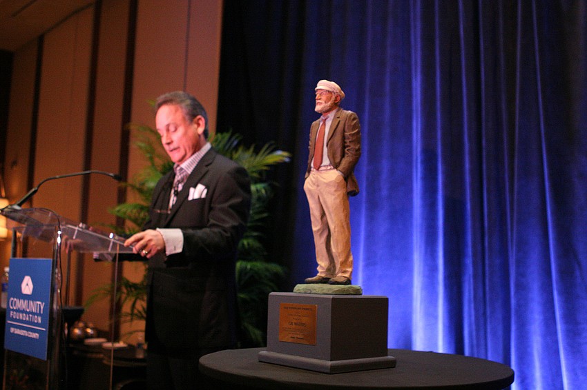 Chris Waters speaks to the crowd after the unveiling of the SRQ Visionary Tribute award.