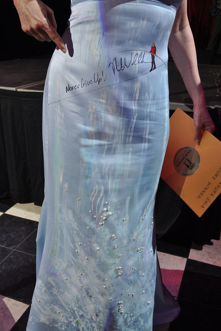 Charlie Lenger decorated her dress with Nik Wallenda crossing Niagra Falls by using stick-on pearls, fabric paint and magic markers. Wallenda signed her dress at the gala.