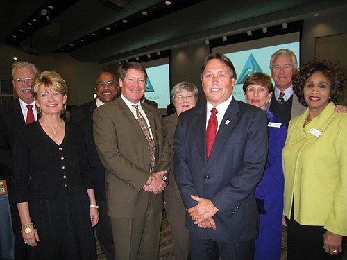 Dr. Steven Wallace, (fourth from right) president of Florida State College, with the school's board of directors.