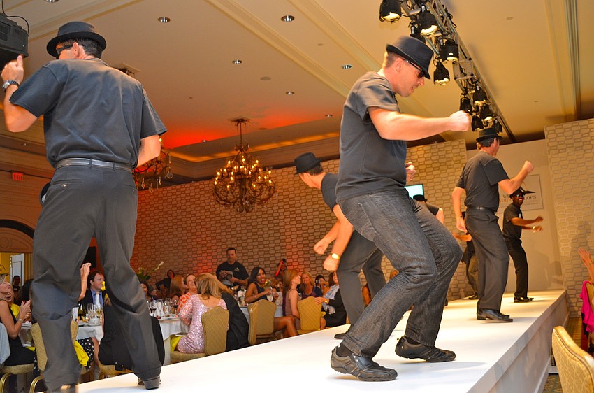 The sole men entertain the ladies.