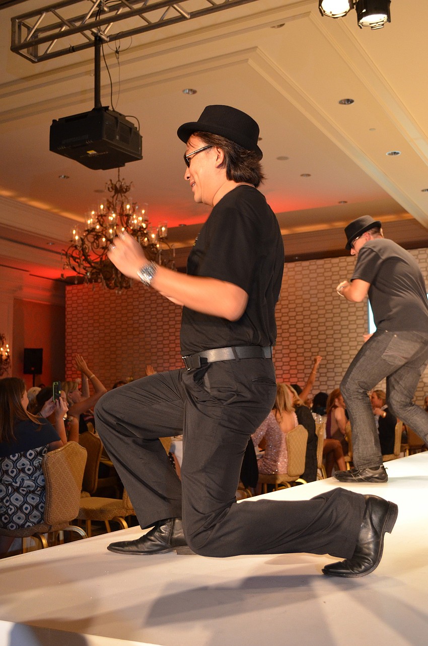 The sole men entertain the ladies.