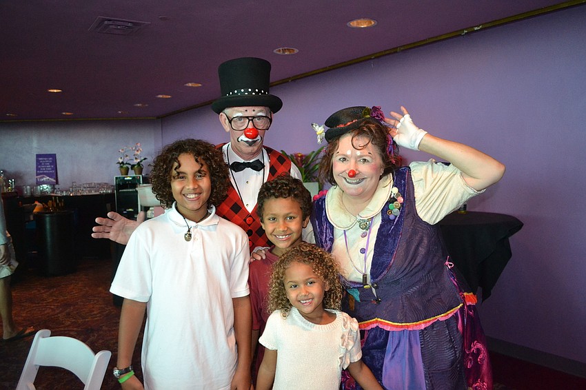 Clowns Robin Eurich and Karen Bell behind Dawitt, Alitash and Mikael Tafesse