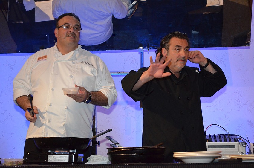 Phil Mancini informs guests there are only five minutes remaining in the silent auction.