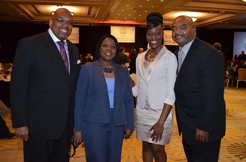 Trevor Harvey, president of NAACP Sarasota County Branch, event Chairwoman Cynthia Howard, Maiyah Newsome and Johnny (Pete) Castleberry