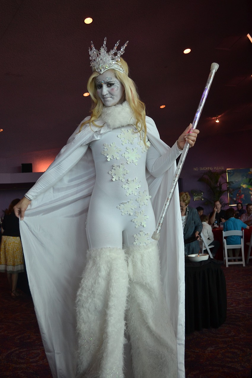 Stilt walker Nicole Hays from Tampa as the luncheon's Snow Queen