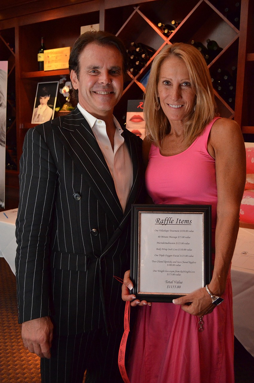 Bill McComb and raffle winner Sunny Moss