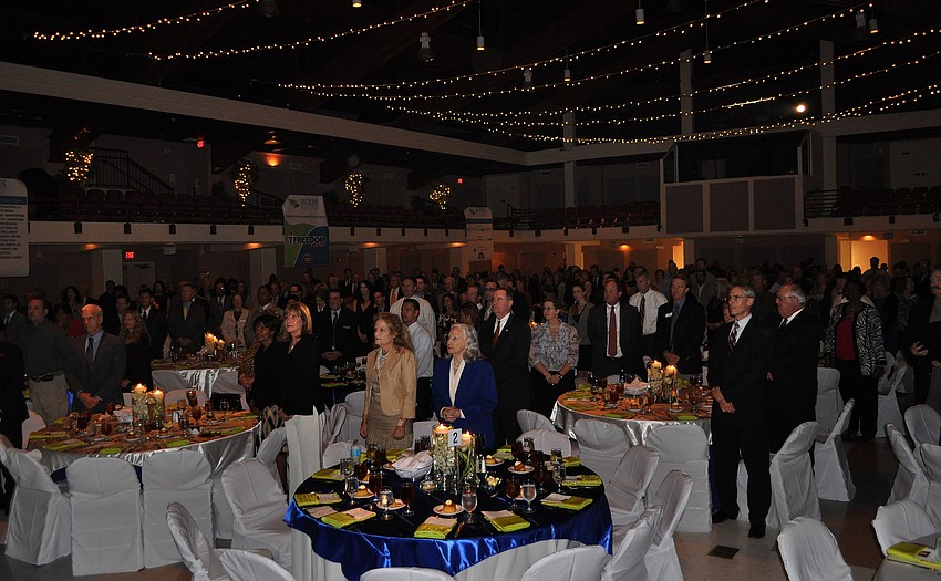 Guests stand for the Pledge of Allegiance as well as for a prayer prior to their meal.