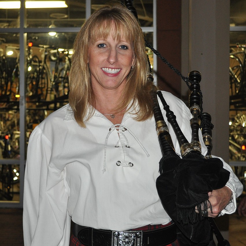 Anne Miller held her bagpipe.