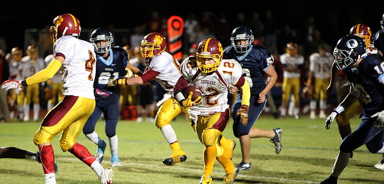 Anthony Caiazzo, No. 12, makes his way down the field Friday, Nov. 9, during the Cardinal Mooney versus The Out-of-Door Academy game at Thunder Stadium.