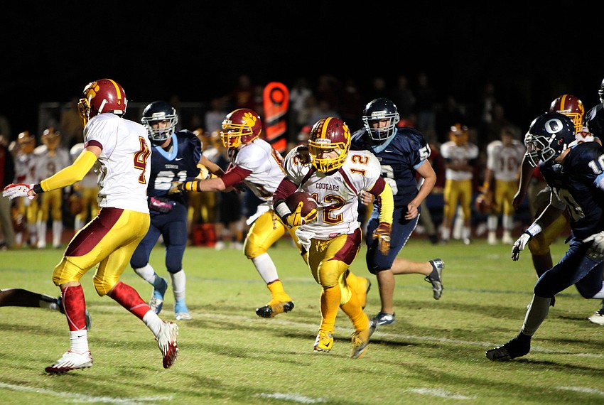 Anthony Caiazzo, No. 12, makes his way down the field Friday, Nov. 9, during the Cardinal Mooney versus The Out-of-Door Academy game at Thunder Stadium.