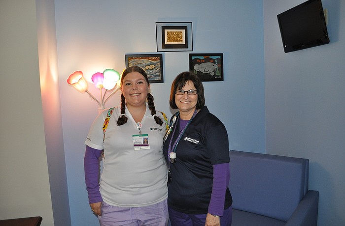 Ashley Rogers-Ramos and Millie Ordham, both pediatric nurses at Lakewood Ranch Medical Center, inside one of six family-size suites in the new pediatric unit