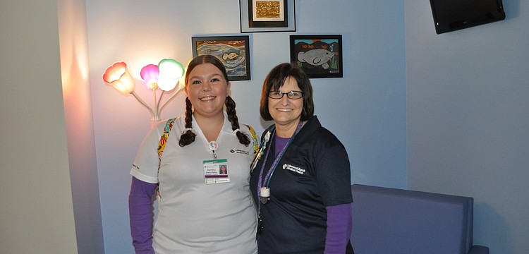 Ashley Rogers-Ramos and Millie Ordham, both pediatric nurses at Lakewood Ranch Medical Center, inside one of six family-size suites in the new pediatric unit