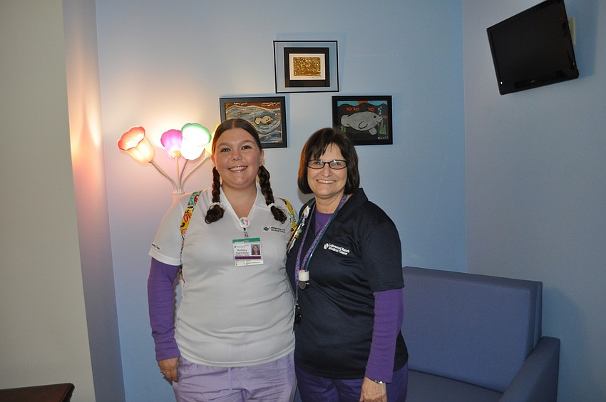 Ashley Rogers-Ramos and Millie Ordham, both pediatric nurses at Lakewood Ranch Medical Center, inside one of six family-size suites in the new pediatric unit