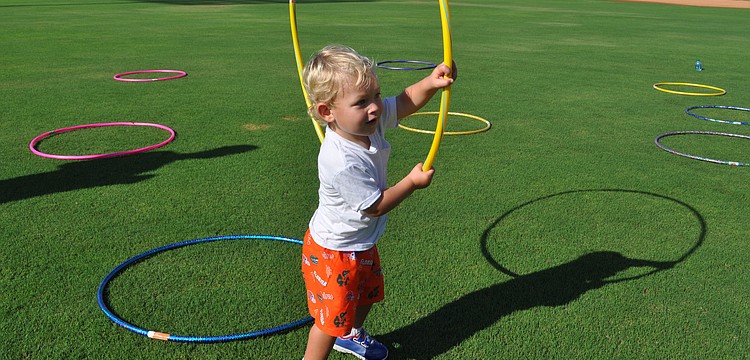 R.J. Lodge plays with a hula-hoop.