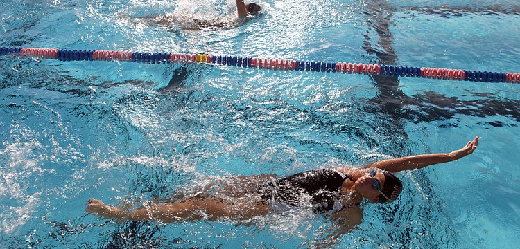 Sofia Hernandez-Tome, 9th grade at Riverview High School, does the backstroke during one of her events during the swim meet Wednesday, Sept. 12.