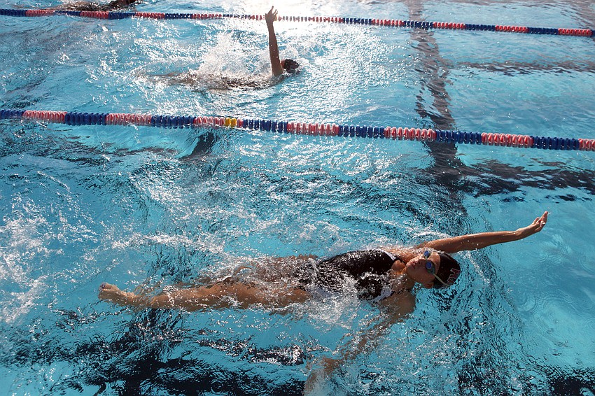 Sofia Hernandez-Tome, 9th grade at Riverview High School, does the backstroke during one of her events during the swim meet Wednesday, Sept. 12.