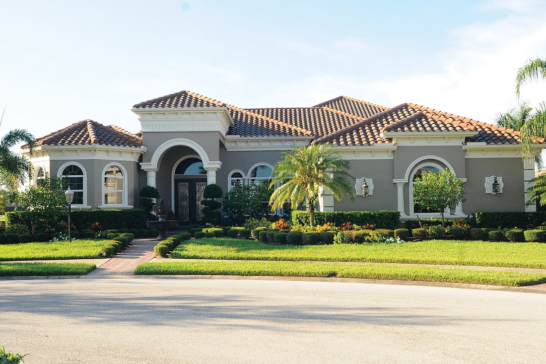 This Country Club Village at Lakewood Ranch home, which has four bedrooms, four-and-a-half baths, a pool and 5,437 square feet of living, sold for $1,637,500. Photo by Jen Blanco.