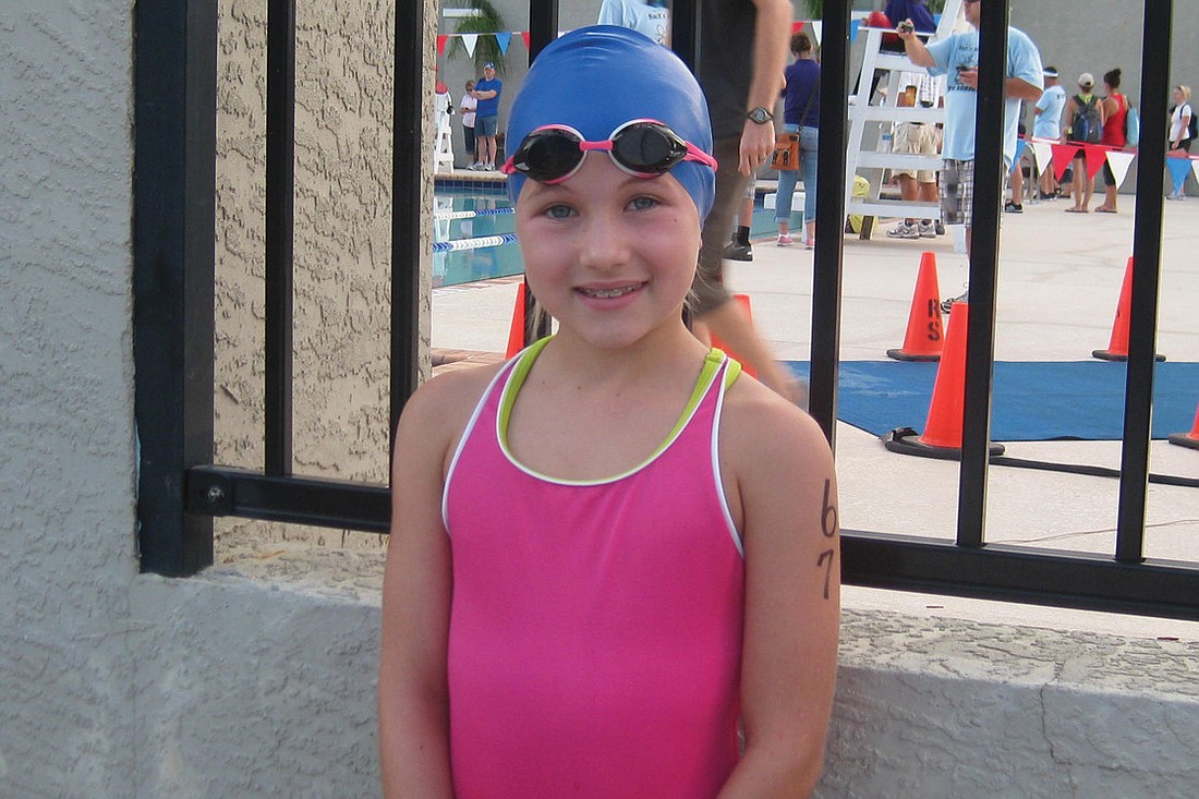 Eight-year-old Emery Muller won her age division of the RocknÃ¢â‚¬â„¢ Heartland Youth Triathlon Series, finishing the race in 18 minutes, 30 seconds.