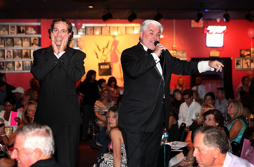 Jacob Spooner puts his hands up to his face as Cliff Roles tries to find the highest bidder.