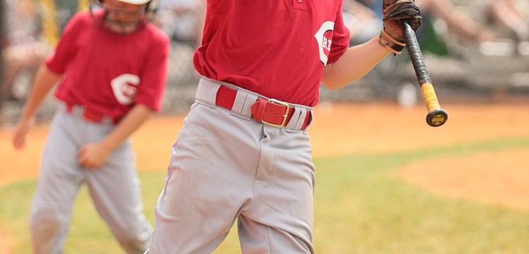 Jordan Shields celebrates after scoring a run for the Reds Minors team. Photos courtesy of Julie McCray.