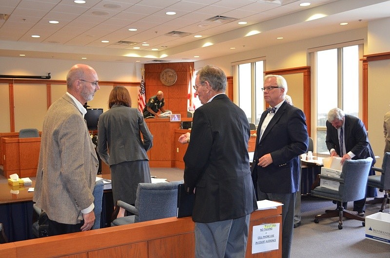 Town Manager Dave Bullock, Vice Mayor David Brenner and town attorney David Persson hold a discussion after a court hearing at the Judge Lynn N. Silvertooth Judicial Center Thursday in Sarasota.