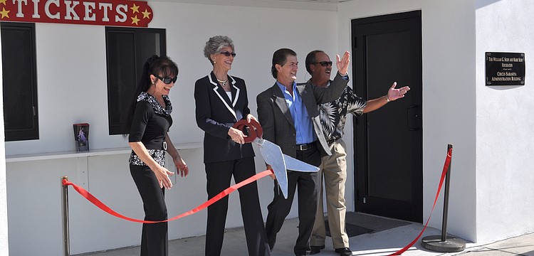 Dolly Jacobs, Sarah Pappas, Pedro Reis and Mitch McKnight cut the ceremonial ribbon.