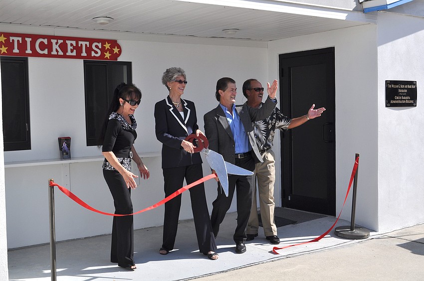 Dolly Jacobs, Sarah Pappas, Pedro Reis and Mitch McKnight cut the ceremonial ribbon.