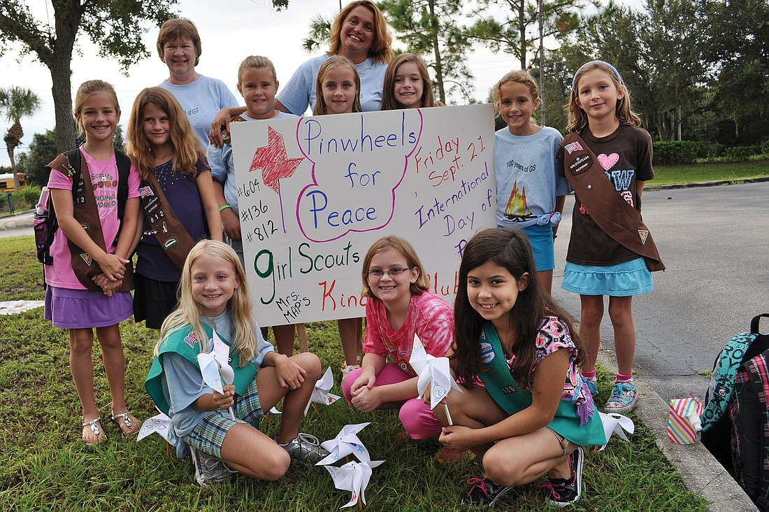 Girl Scout Troops 812 and 136 made dozens of pinwheels to put out for International Peace Day Sept. 21.