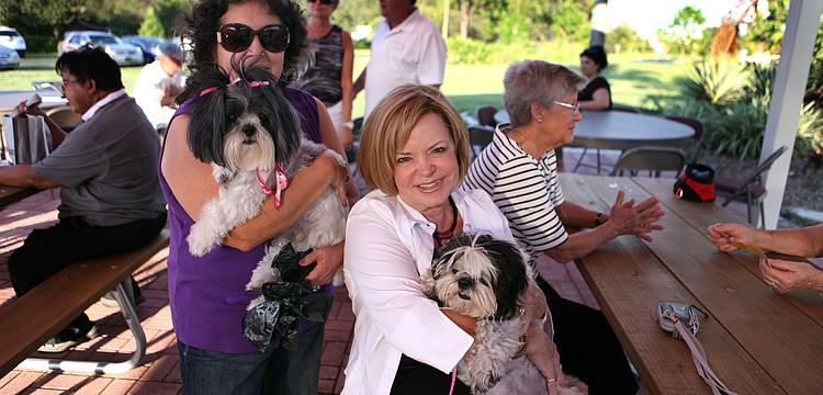 Carmen Senchyshyn with her dog, Molly McMuffin, 8, and Karen Tranter with her dog, Lexi Noel, 8, Friday, Sept. 28 during the pet blessing ceremony at Our Lady of Mount Carmel in Osprey.