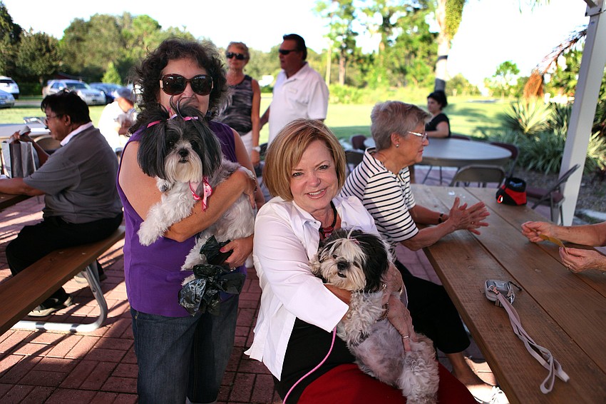 Carmen Senchyshyn with her dog, Molly McMuffin, 8, and Karen Tranter with her dog, Lexi Noel, 8, Friday, Sept. 28 during the pet blessing ceremony at Our Lady of Mount Carmel in Osprey.
