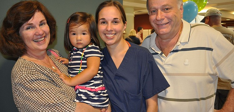 Mia Lin had fun with her mother, Dr. Nikki Lin, center, and grandparents Dolly and Dr. Eugene Usberghi.