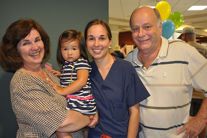 Mia Lin had fun with her mother, Dr. Nikki Lin, center, and grandparents Dolly and Dr. Eugene Usberghi.