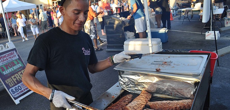 Luis de Jesus, of Pincher's Crab Shack, prepared ribs for the crowd.