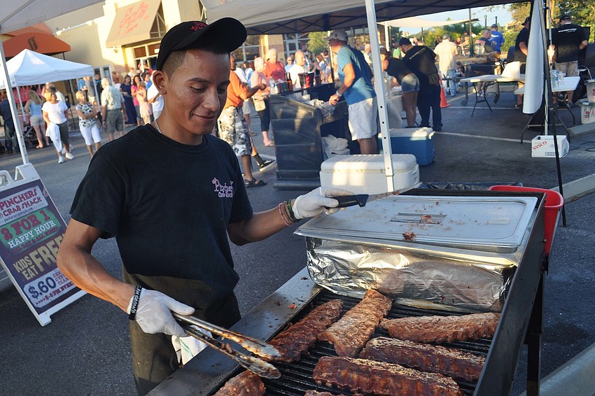 Luis de Jesus, of Pincher's Crab Shack, prepared ribs for the crowd.