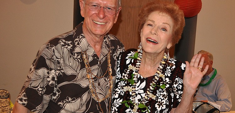 Vincent and Anne Stenger wore outfits they bought in Hawaii to the Knights of Columbus Annual Luau at St. Michael the Archangel.