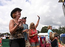 Nancy Winner, Tom Morrissey and Suzy Rogers dance during Paul Thornâ€™s set Saturday, Sept. 29.