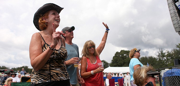 Nancy Winner, Tom Morrissey and Suzy Rogers dance during Paul Thornâ€™s set Saturday, Sept. 29.