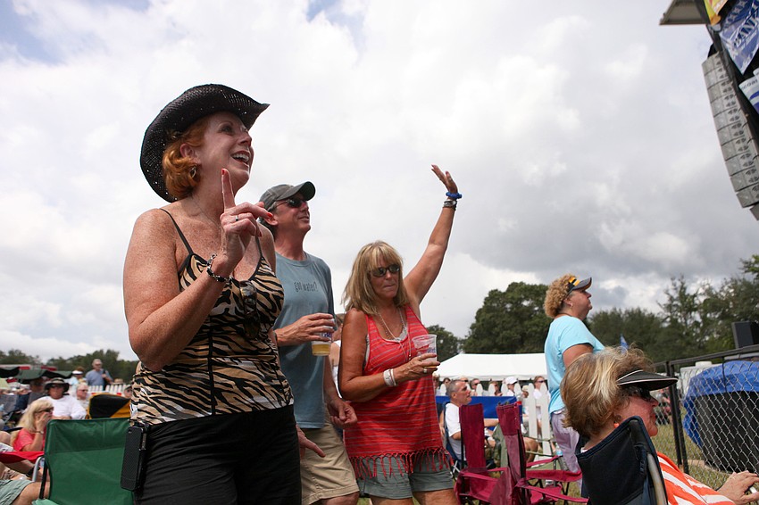 Nancy Winner, Tom Morrissey and Suzy Rogers dance during Paul Thornâ€™s set Saturday, Sept. 29.