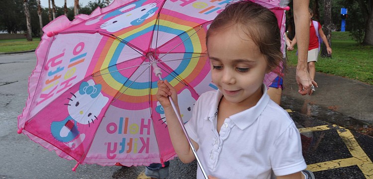 Maya Griffin, 4, was prepared for the rain.