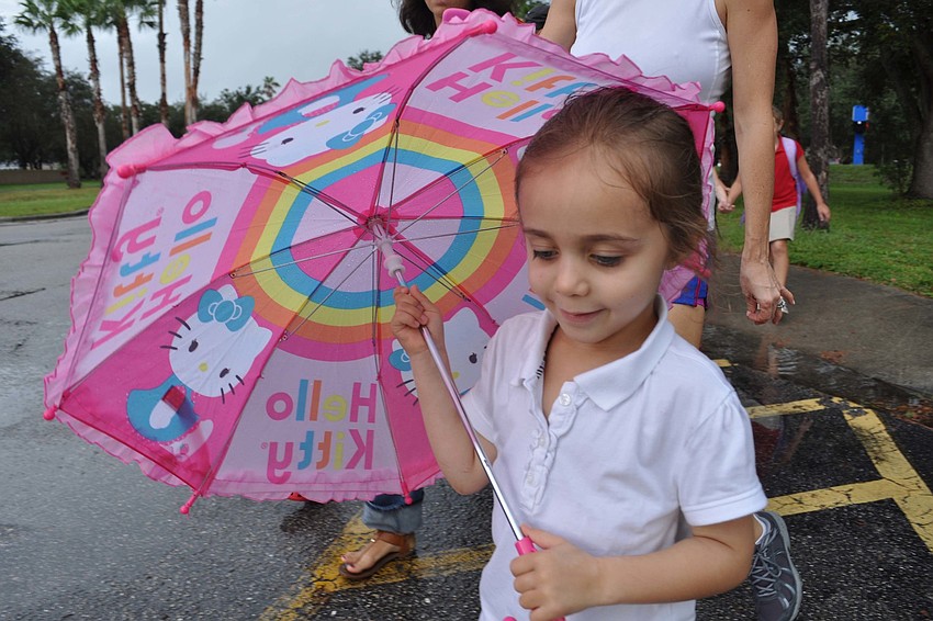 Maya Griffin, 4, was prepared for the rain.