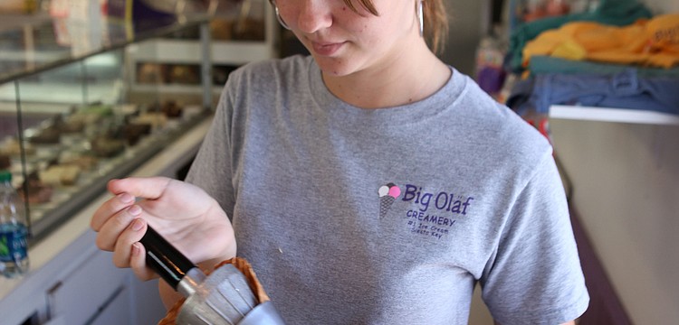 Cindy Walsh makes waffle cones Monday, Oct. 1 at Big Olaf on Siesta Key. Walsh estimates that she makes around 50 waffle cones a day.
