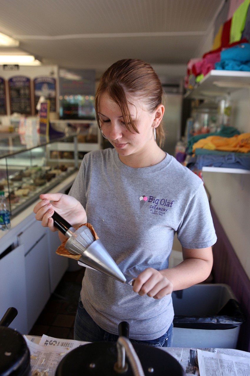 Cindy Walsh makes waffle cones Monday, Oct. 1 at Big Olaf on Siesta Key. Walsh estimates that she makes around 50 waffle cones a day.