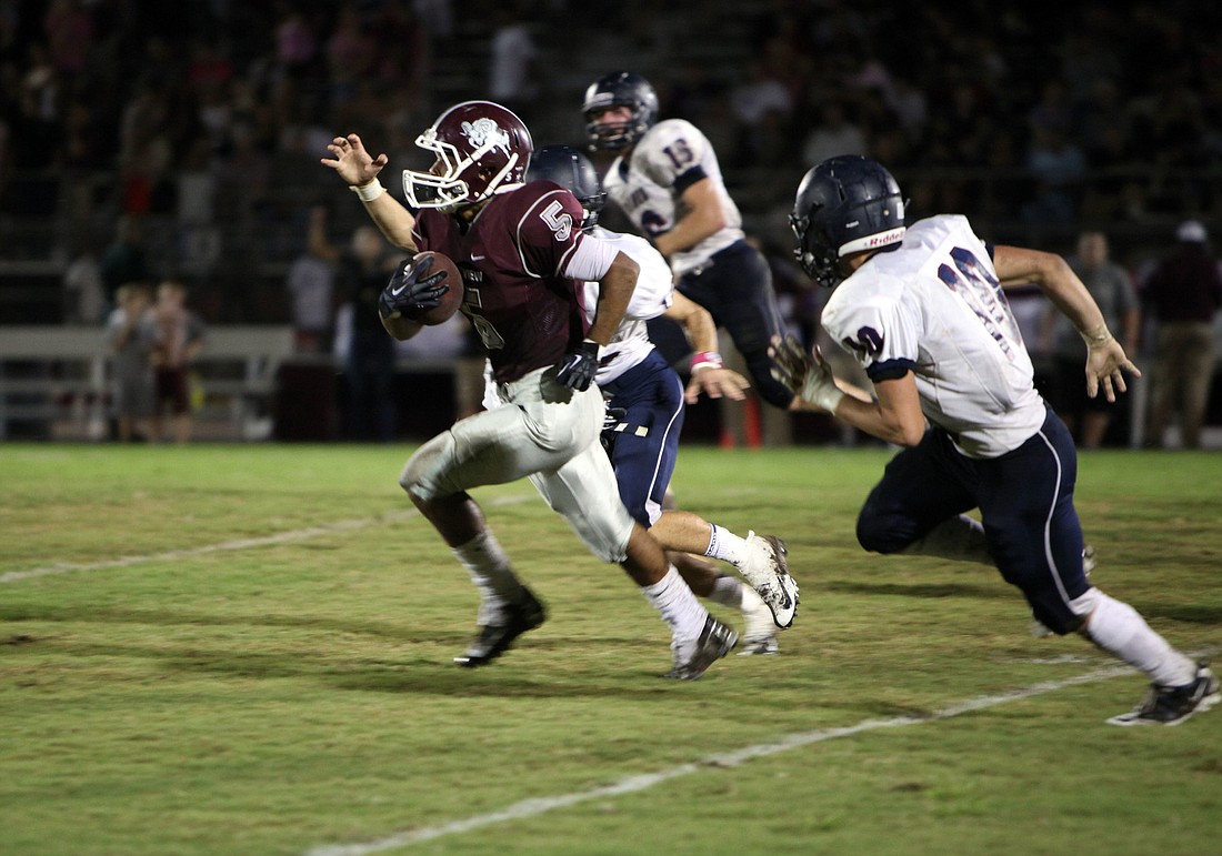 Jaden Adams, No. 5, runs up the field with the ball Friday, Oct. 5, during the Riverview homecoming game.