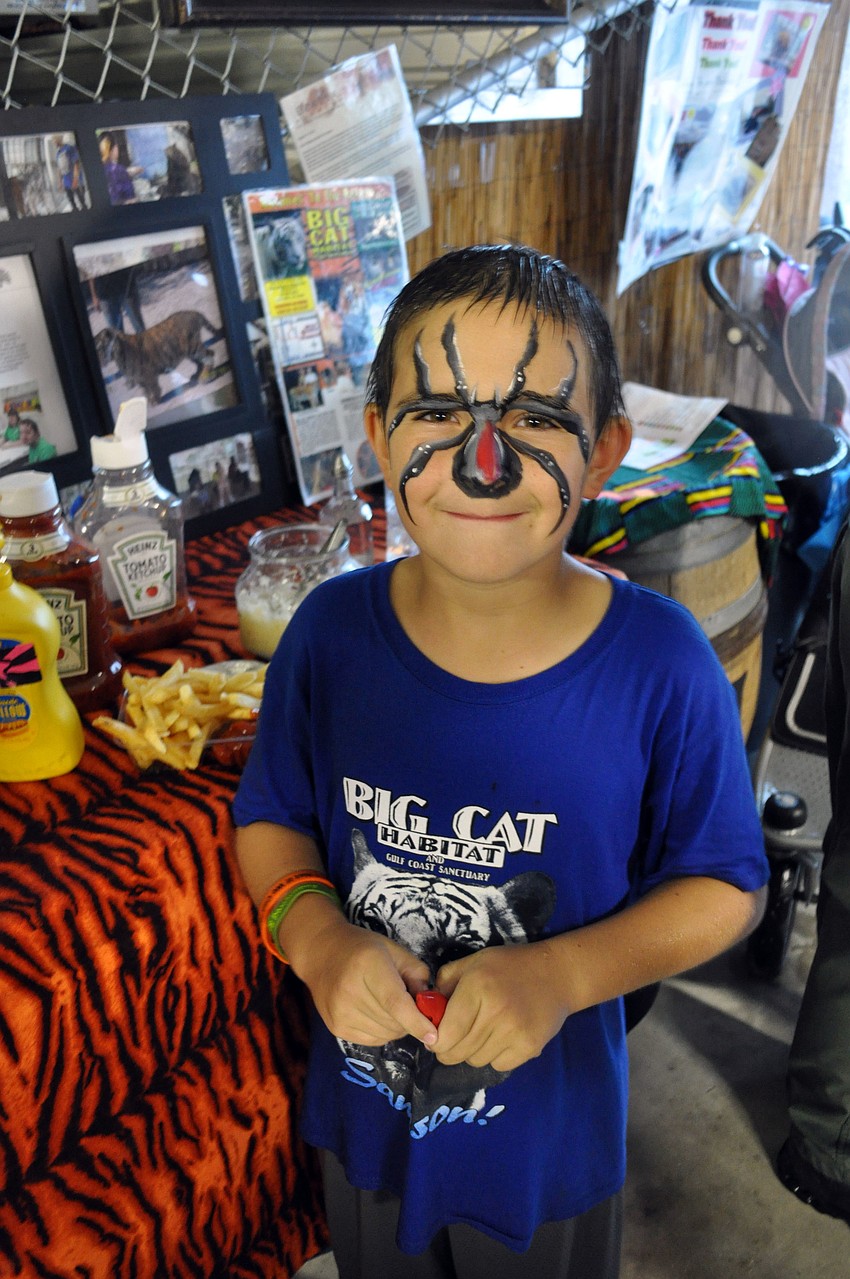 Garrett Sennott shows off his face paint.