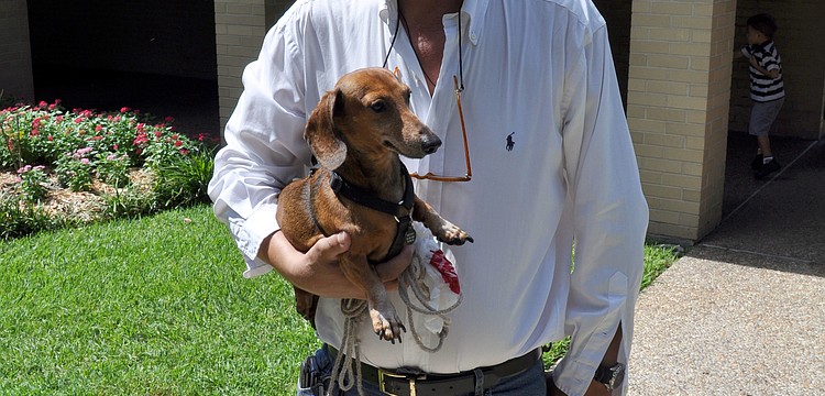 Christopher Maestri poses with his dog, Gretchen.