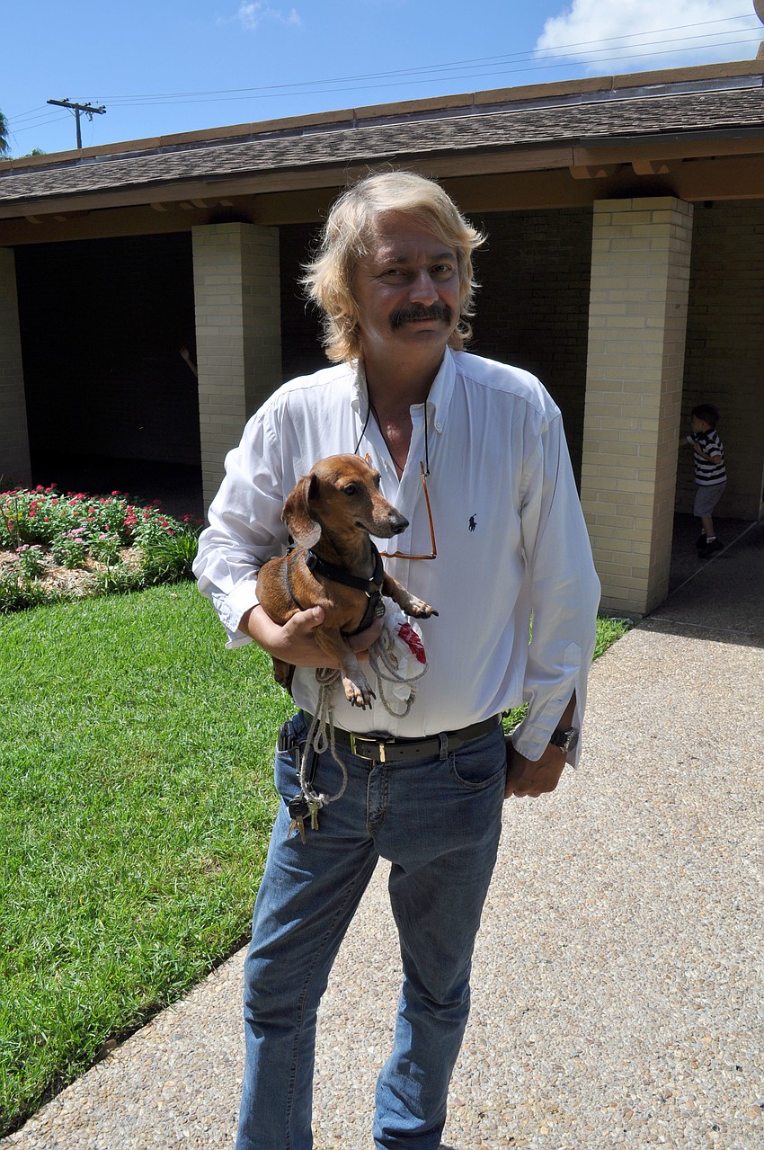Christopher Maestri poses with his dog, Gretchen.
