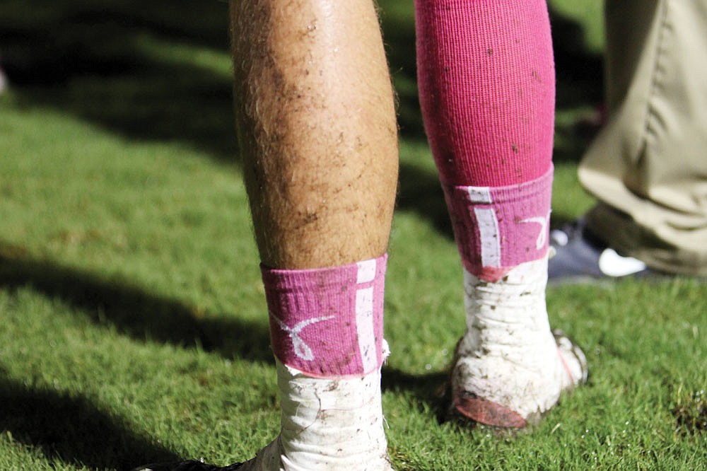 Lex Sayre, No. 15, was one of many Riverview players sporting pink socks to show support for National Breast Cancer Awareness Month. Photo by Rachel S. O'Hara.